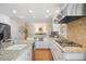 Kitchen features stainless steel appliances, granite countertops, and white cabinetry at 2608 York Rd, Raleigh, NC 27608