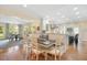 Open kitchen with breakfast bar and stainless steel vent hood overlooking informal dining area at 2608 York Rd, Raleigh, NC 27608