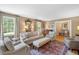 Cozy living room with ample natural light, classic decor, and comfortable seating at 2608 York Rd, Raleigh, NC 27608