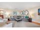 Bright living room featuring a gray sectional sofa, neutral walls, and stylish decor at 2608 York Rd, Raleigh, NC 27608