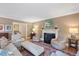 Warm living room with a fireplace, a patterned rug and classic furniture at 2608 York Rd, Raleigh, NC 27608