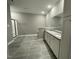 Modern bathroom featuring double vanity with granite countertop and a walk-in shower at 268 Busterfield Ct, Benson, NC 27504