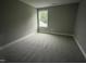 Neutral bedroom featuring a window and soft gray carpet at 268 Busterfield Ct, Benson, NC 27504