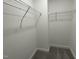 Walk-in closet with carpet and wire shelving for optimal organization and storage at 268 Busterfield Ct, Benson, NC 27504