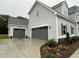 Attached two-car garage and detached one car garage with a spacious driveway at 268 Busterfield Ct, Benson, NC 27504