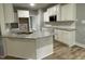 New kitchen featuring granite countertops, white cabinets, and stainless steel appliances at 268 Busterfield Ct, Benson, NC 27504