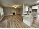 Open floorplan featuring living room with fireplace and modern kitchen with bar seating at 268 Busterfield Ct, Benson, NC 27504