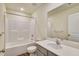A well-lit bathroom featuring a shower-tub combination and modern vanity at 2700 Barrington Dr, Raleigh, NC 27610