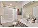 A well-lit bathroom featuring a shower-tub combination and modern vanity at 2700 Barrington Dr, Raleigh, NC 27610