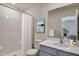 Clean bathroom featuring a shower-tub combo, a vanity with a gray quartz countertop at 2700 Barrington Dr, Raleigh, NC 27610