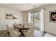 Elegant dining room featuring a wooden table, seating for six, and sliding glass doors at 2700 Barrington Dr, Raleigh, NC 27610