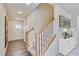 Bright entryway with wood flooring, a staircase, and a white accent console at 2700 Barrington Dr, Raleigh, NC 27610