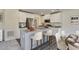 Modern kitchen with white cabinetry, granite countertops, and stainless steel appliances at 2700 Barrington Dr, Raleigh, NC 27610
