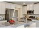 Beautiful kitchen with stainless steel appliances, granite countertops, and white cabinets at 2700 Barrington Dr, Raleigh, NC 27610