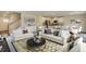 Cozy living room with an open floor plan connecting to the dining and kitchen area at 2700 Barrington Dr, Raleigh, NC 27610