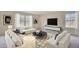 Living room featuring abundant natural light, neutral walls, and plush seating at 2700 Barrington Dr, Raleigh, NC 27610