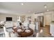 Open-concept living space with a dining area, kitchen island, and a cozy living room at 2700 Barrington Dr, Raleigh, NC 27610