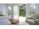 View from the main bedroom balcony with an outdoor seating area and view of trees at 2800 Charleston Oaks Dr, Raleigh, NC 27614