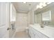 Cozy bathroom featuring a tub and shower, vanity, and neutral tones at 2800 Charleston Oaks Dr, Raleigh, NC 27614
