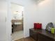 Entryway adjacent to a half bathroom that offers modern fixtures, decorative tile flooring, and bench seating at 2800 Charleston Oaks Dr, Raleigh, NC 27614
