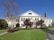 Beautiful clubhouse featuring manicured lawns and mature trees, creating an inviting atmosphere for community gatherings at 2800 Charleston Oaks Dr, Raleigh, NC 27614