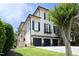 Charming three-story home with black shutters, three-car garage, and well-manicured lawn at 2800 Charleston Oaks Dr, Raleigh, NC 27614