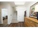 Entryway featuring wood floors, stairs, wood accents and a storage closet at 2800 Charleston Oaks Dr, Raleigh, NC 27614
