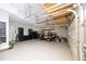 Spacious garage with epoxy flooring, storage cabinets, and a convenient golf cart at 2800 Charleston Oaks Dr, Raleigh, NC 27614