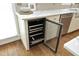 Kitchen includes a wine cooler, light countertops and cabinets, and stainless steel appliances at 2800 Charleston Oaks Dr, Raleigh, NC 27614