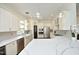 Well-equipped kitchen features stainless steel appliances, granite countertops, and ample cabinet space at 2800 Charleston Oaks Dr, Raleigh, NC 27614