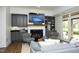 Inviting living room with a fireplace, hardwood floors, built-ins, and natural light at 2800 Charleston Oaks Dr, Raleigh, NC 27614