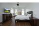 This main bedroom boasts hardwood floors, crown moulding, and a dark wood furniture set at 2800 Charleston Oaks Dr, Raleigh, NC 27614