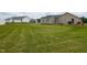 Spacious backyard featuring a storage shed, well-maintained lawn, and lush green space at 286 Beaver Tavern Dr, Benson, NC 27504