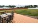 Wooden backyard deck with patio seating and a large grassy backyard at 286 Beaver Tavern Dr, Benson, NC 27504