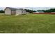 Large backyard featuring a storage shed and a well-maintained lawn at 286 Beaver Tavern Dr, Benson, NC 27504
