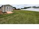 Spacious backyard with a storage shed, ramp, and lawn at 286 Beaver Tavern Dr, Benson, NC 27504