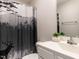 The bathroom features a vanity, toilet, and shower with decorative nature-themed shower curtain at 286 Beaver Tavern Dr, Benson, NC 27504
