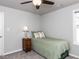 This is a cozy bedroom featuring neutral walls, carpet, and window at 286 Beaver Tavern Dr, Benson, NC 27504