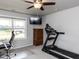 Well-lit room with a treadmill and desk, perfect for a home gym or office at 286 Beaver Tavern Dr, Benson, NC 27504