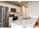 An eat-in kitchen features granite countertops, stainless appliances, and white cabinets at 286 Beaver Tavern Dr, Benson, NC 27504