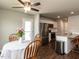 A white kitchen with stainless steel appliances, and granite countertops at 286 Beaver Tavern Dr, Benson, NC 27504