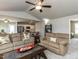 Spacious living room with ceiling fan opens to the breakfast nook and kitchen at 286 Beaver Tavern Dr, Benson, NC 27504