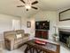 This is a shot of the living room showing the fireplace, fan, and television at 286 Beaver Tavern Dr, Benson, NC 27504