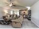 Open living room area with ceiling fan opens to the breakfast nook and kitchen at 286 Beaver Tavern Dr, Benson, NC 27504