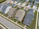 Aerial view of a neighborhood with gray and beige houses and green lawns at 2915 Winter Crop Way, Apex, NC 27502