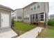 Backyard showcasing the home's exterior, patio, and well-maintained lawn at 2915 Winter Crop Way, Apex, NC 27502