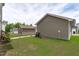 View of the backyard, detached garage, and a sidewalk path at 2915 Winter Crop Way, Apex, NC 27502