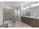 Main bathroom featuring double sinks, a glass shower, and tile floors at 2915 Winter Crop Way, Apex, NC 27502