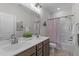 Bright bathroom featuring double sink vanity, a bathtub and shower combo at 2915 Winter Crop Way, Apex, NC 27502