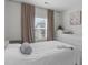 Bedroom with a queen bed, white dresser, window, and curtains at 2915 Winter Crop Way, Apex, NC 27502